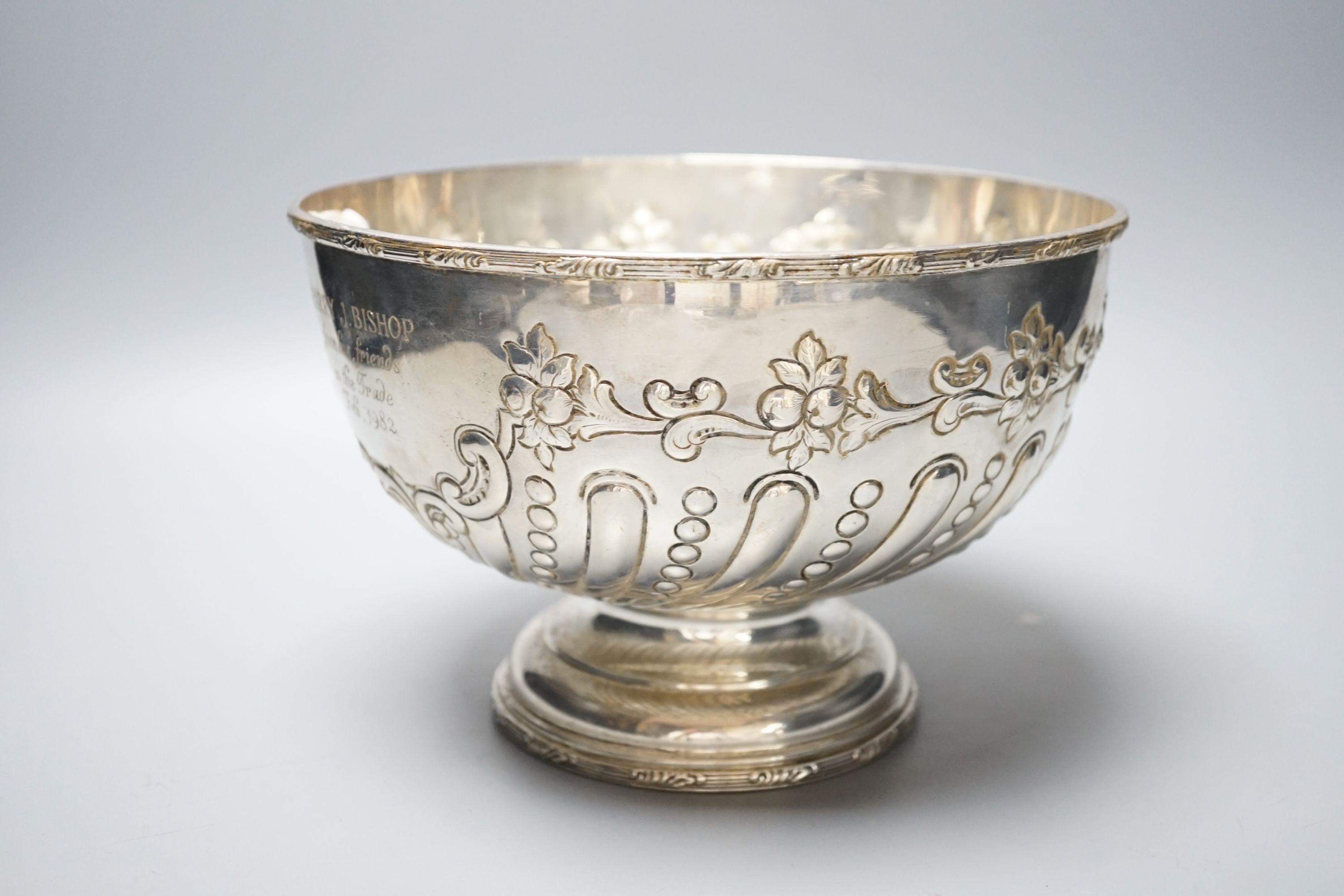 A George V embossed silver rose bowl, with later engraved inscription, Daniel & Arter, Birmingham, 1911, 22.5cm, 25oz.